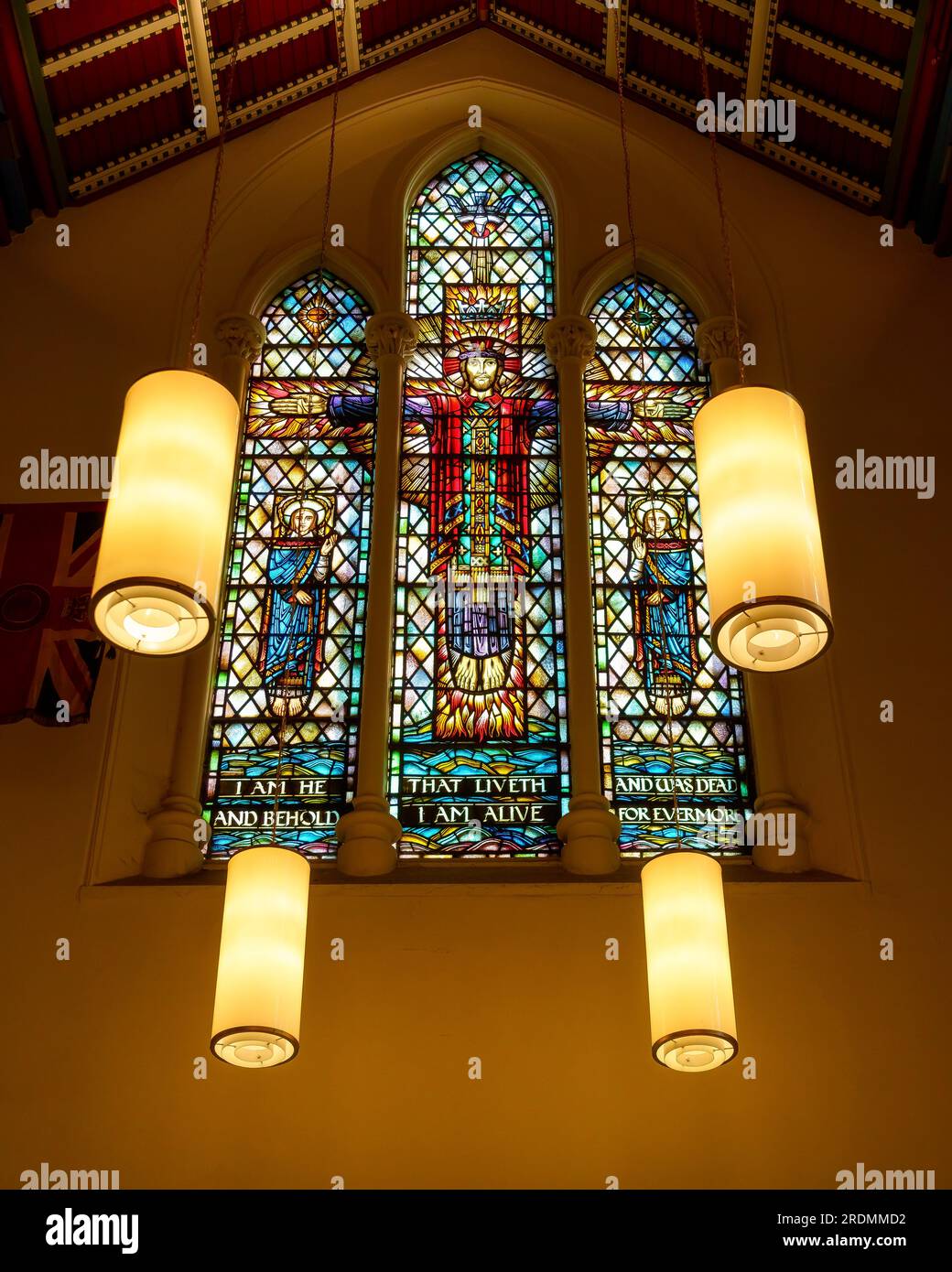 The Cathedral Church of St. James. Stained glass window with electric lamps in the Saint George Chapel Stock Photo