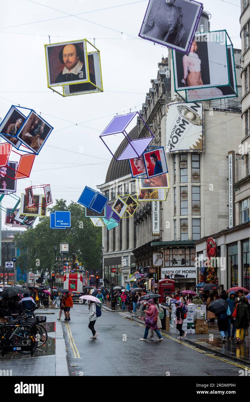 London, UK. 22 July 2023. Decorated cubes hang overhead in Coventry Street, just off Leicester