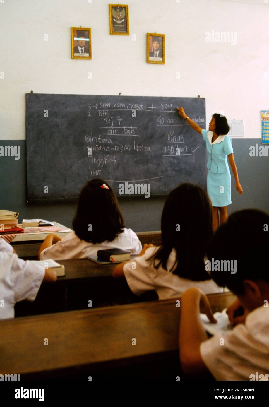 Jakarta Indonesia  School Teacher At Blackboard in Front of Class Stock Photo