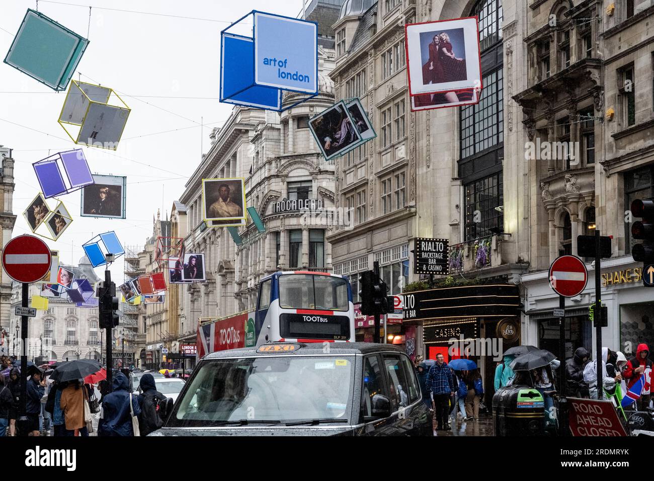 London, UK. 22 July 2023. Decorated cubes hang overhead in Coventry Street, just off Leicester