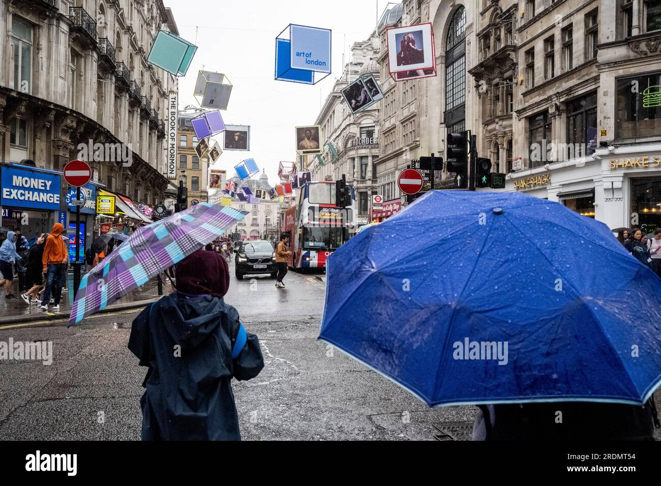 London, UK. 22 July 2023. Decorated cubes hang overhead in Coventry Street, just off Leicester