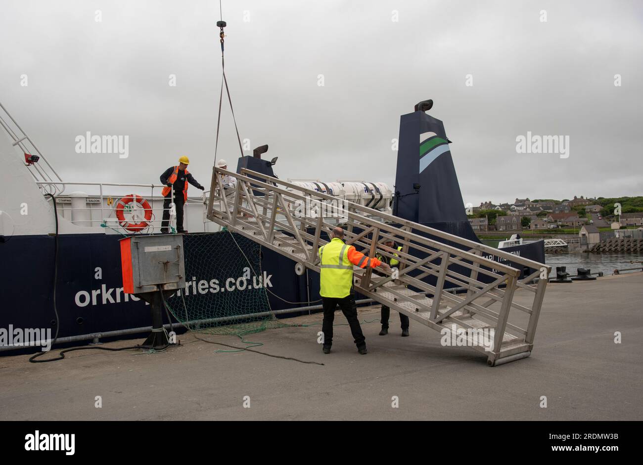 Kirkwall, Orkneys, Scotland, UK. 4 June 2023.  Lifting a ships metal gangway into place on an inter island ferry berthed in Kirkwall, Scotland UK. Stock Photo