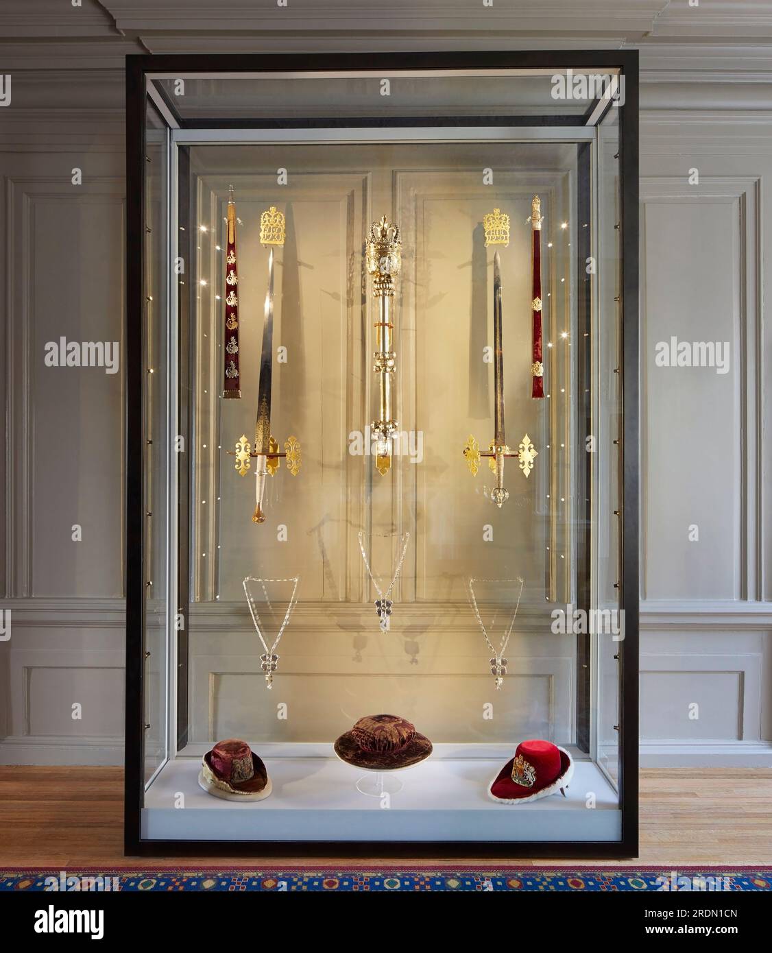 Ceremonial swords and the Mayors Mace inside glass display cabinet. York Mansion House, York, United Kingdom. Architect: De Matos Ryan, 2018. Stock Photo