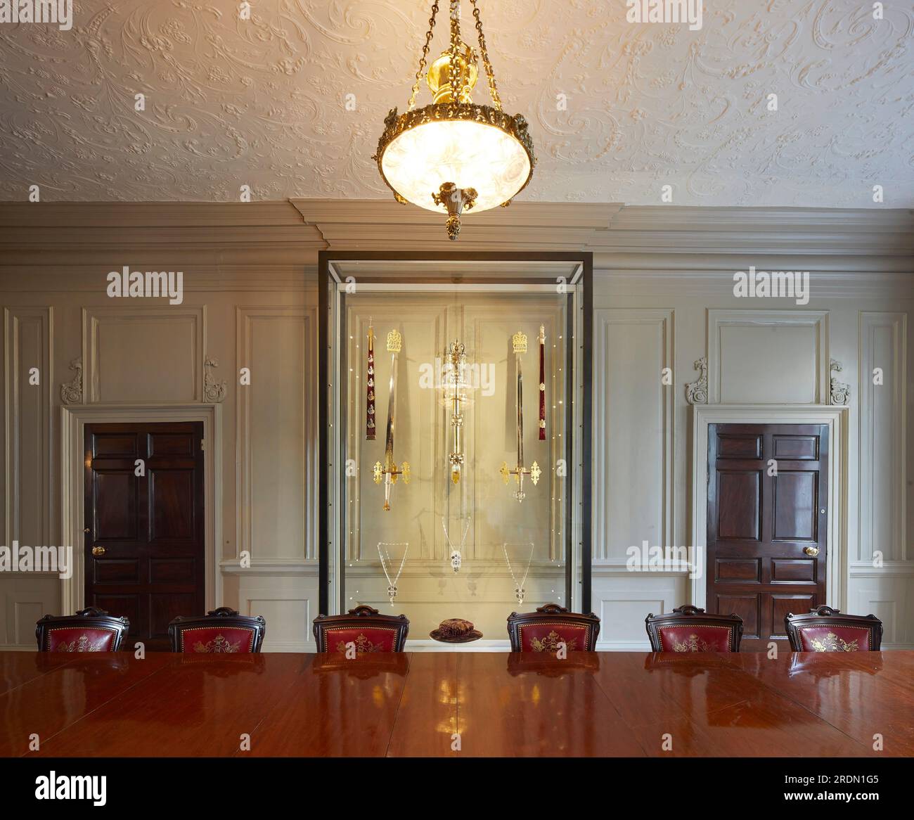 Conference room with display of ceremonial swords and the Mayors Mace. York Mansion House, York, United Kingdom. Architect: De Matos Ryan, 2018. Stock Photo