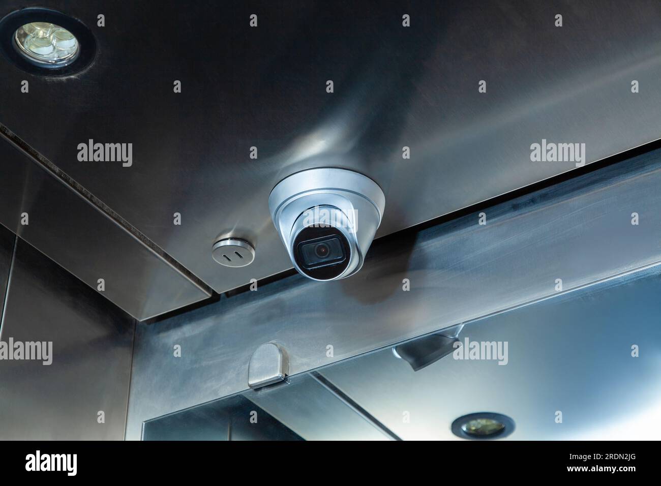 Dome security camera in the public elevator in the business center