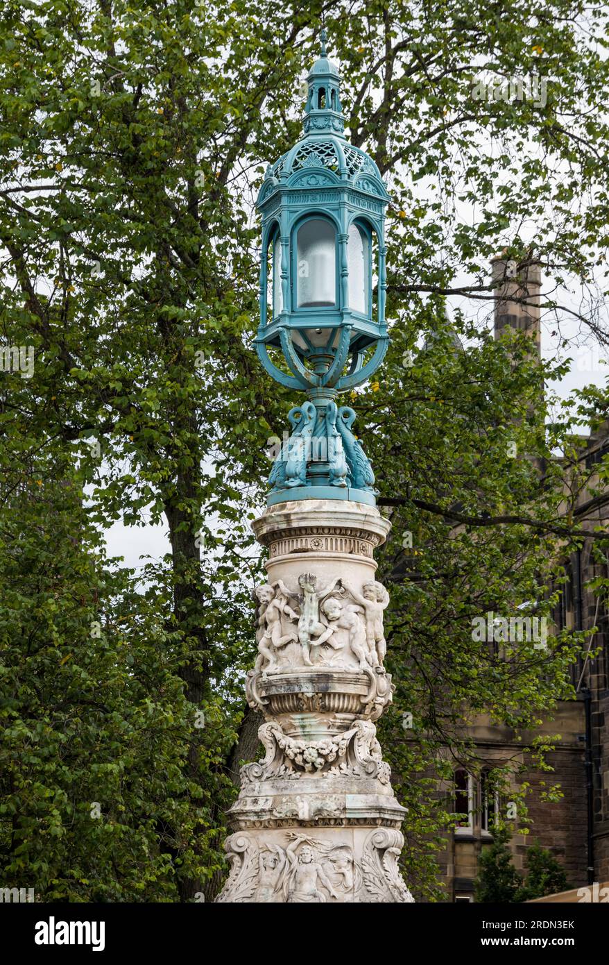Ornate old fashioned Victorian McEwan lamp or lantern pillar, Bristo Square, Edinburgh, Scotland, UK Stock Photo