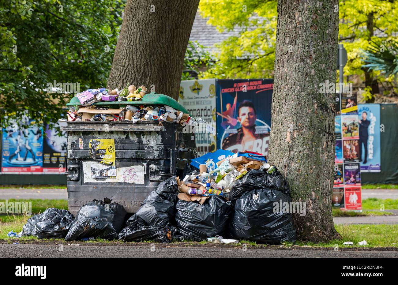 An overflowing rubbish bin during bin collectors strike, The Meadows, Edinburgh, Scotland, UK