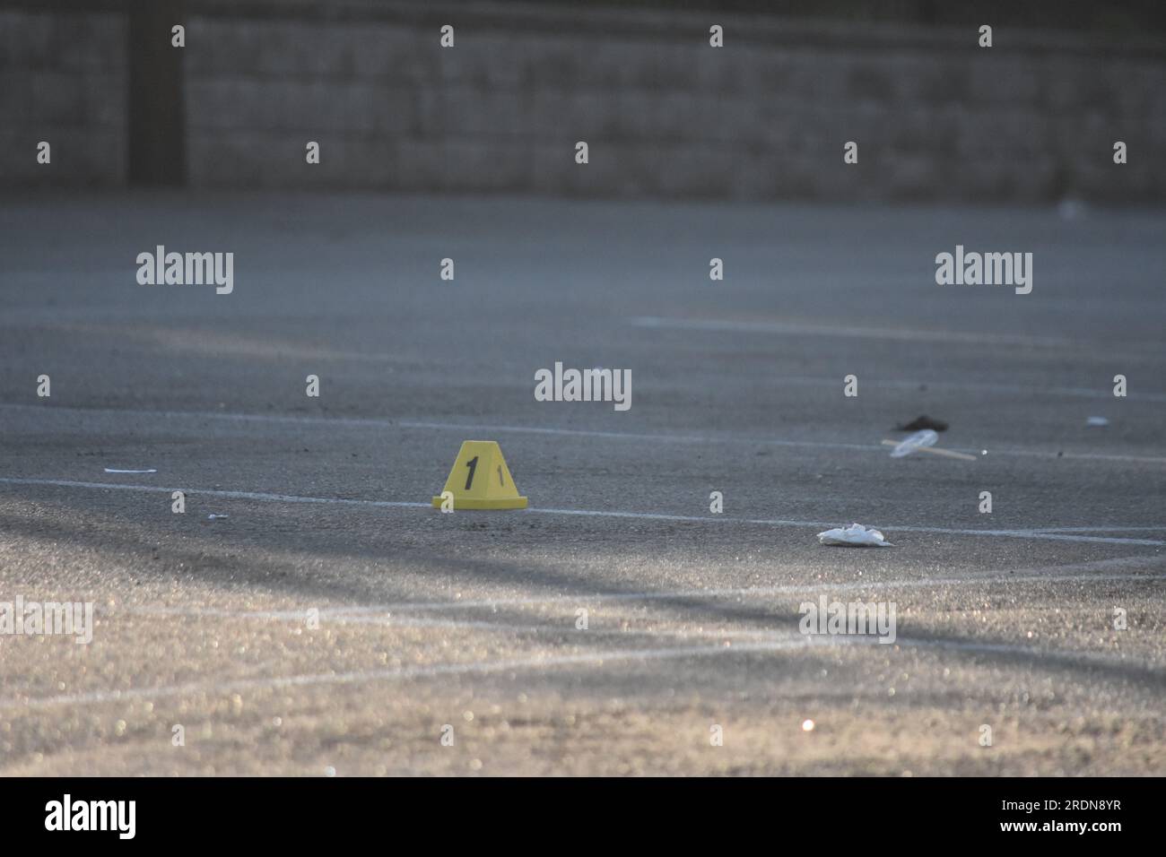 Newark, United States. 22nd July, 2023. Evidence markers seen at the crime scene in Newark. Authorities investigate a shooting at a parking lot outside Marbella Lounge nightclub on Broadway in Newark. The shooting happened around 3:15 AM, Saturday morning. One man was confirmed dead by the Essex County Prosecutor's Office. There is no word on if any suspects were captured. The Essex County Prosecutor's Office is investigating the shooting. Credit: SOPA Images Limited/Alamy Live News Stock Photo