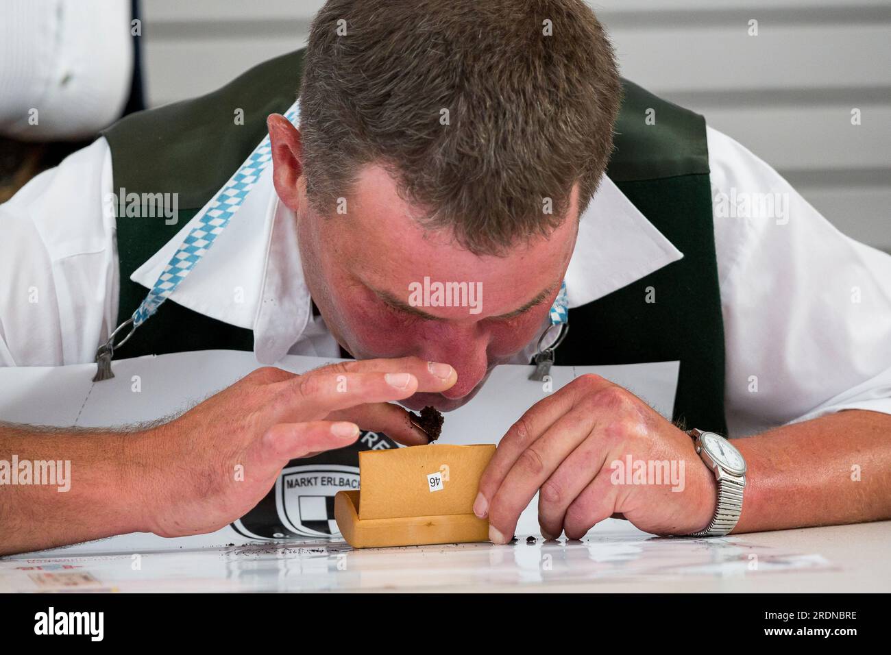 german sniffing tobacco Markt Erlbach, Germany. 22nd July, 2023. A participant in the 54th German  Snuffing Championship snuffs tobacco. Within one minute, the participants  of the 54th German Snuffing Championship have to put as much