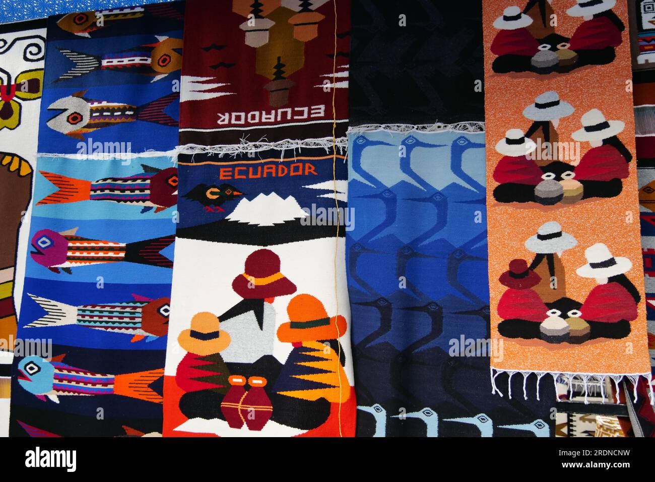 Colorful traditional woven carpets for sale at Otavalo market in