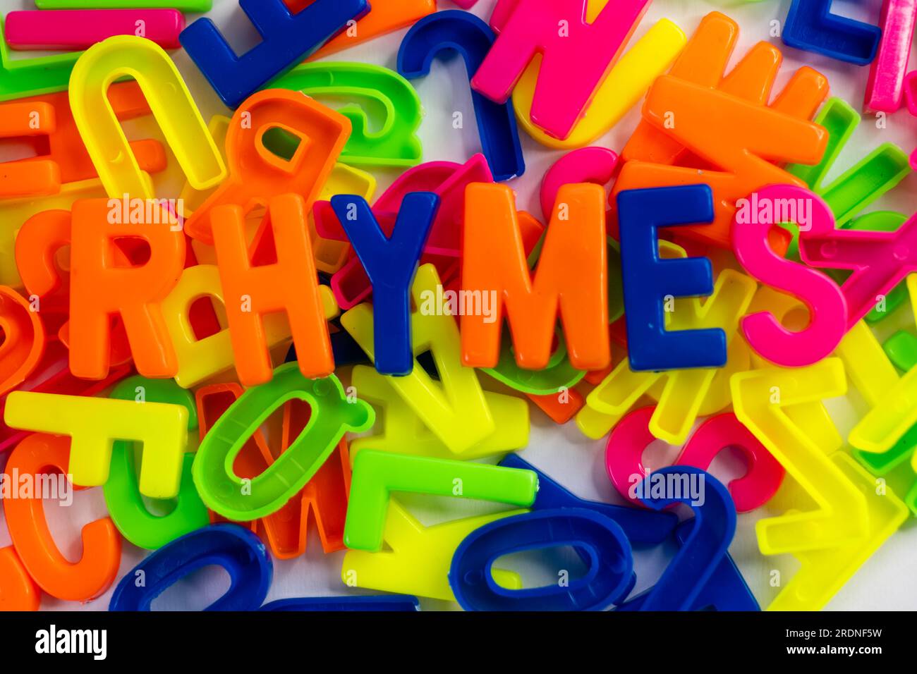 This stock image shows a group of colorful letter magnets spelling out ...