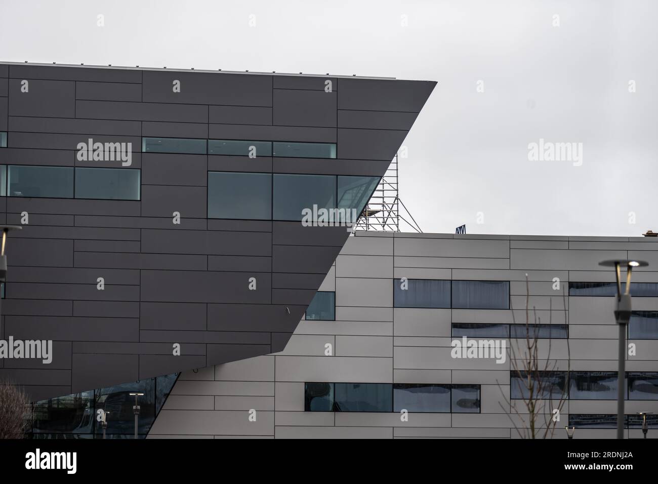 Facade of a modern glass and metal office building Stock Photo - Alamy