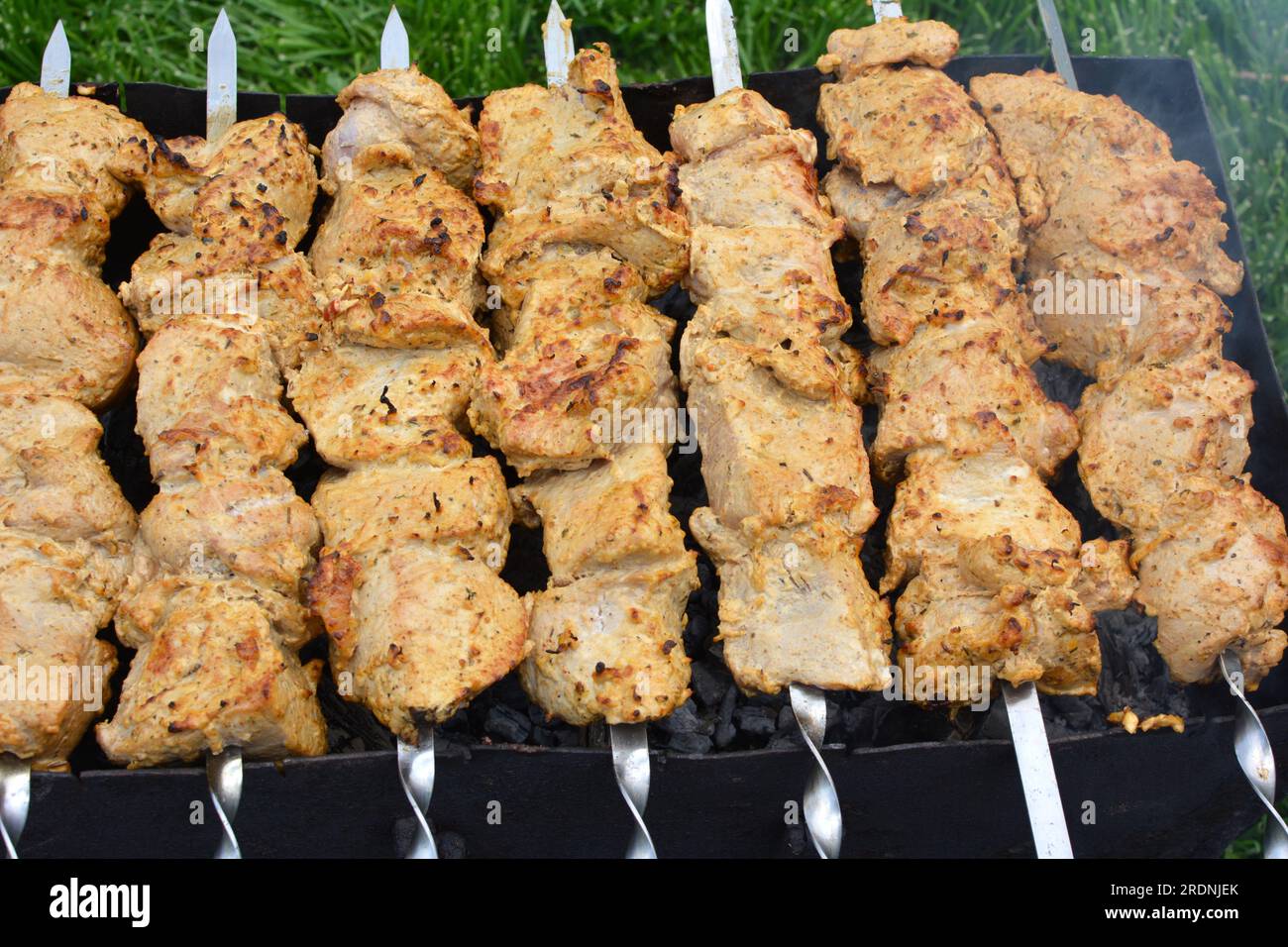 Meat skewers cooked on a hot brazier Stock Photo