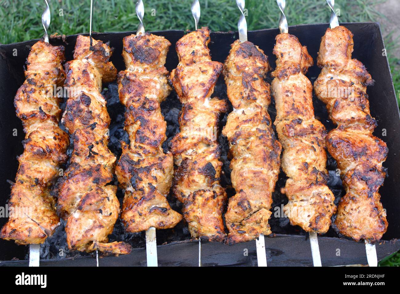 Meat skewers cooked on a hot brazier Stock Photo