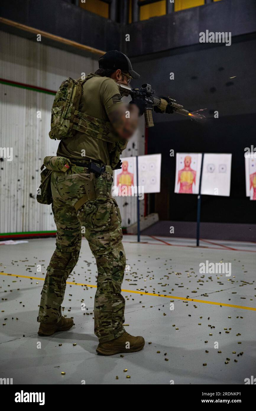 A Green Beret from 1st Special Forces Group (Airborne) executes combat marksmanship training at Holsworthy Barracks indoor range facility during Talisman Sabre 23 in New South Wales, Australia, July 18, 2023. Talisman Sabre is the largest bilateral military exercise between Australia and the United States advancing a free and open Indo-Pacific by strengthening relationships and interoperability among key Allies and enhancing our collective capabilities to respond to a wide array of potential security concerns. (U.S. Army photo by Spc. Christopher Cameron) (This photo has been altered for secur Stock Photo