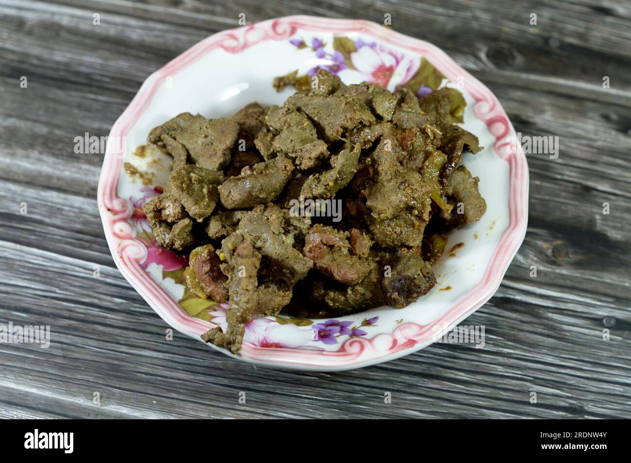 Grilled beef liver sliced in pieces and cooked with oil, white vinegar