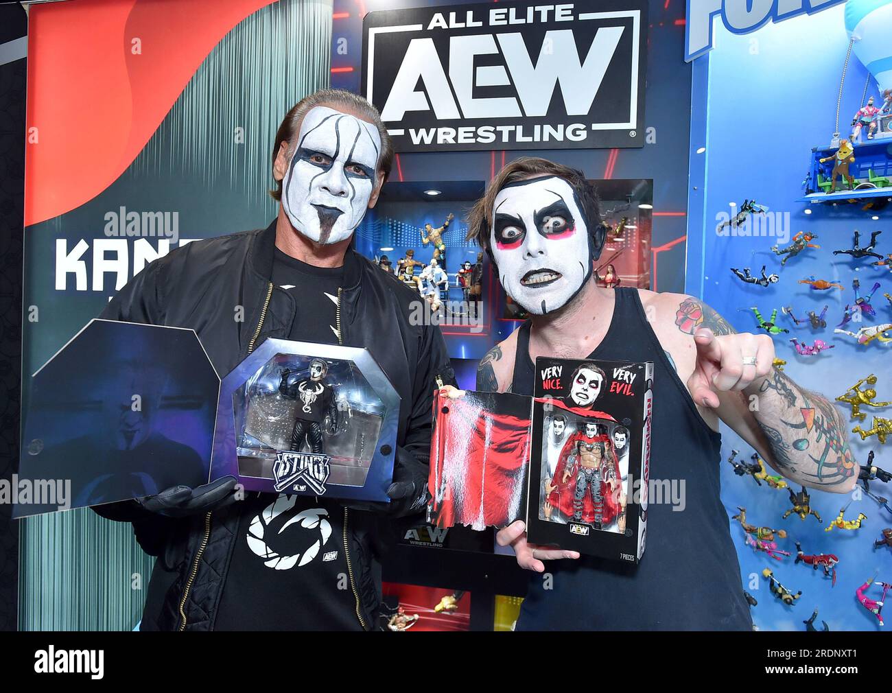 IMAGE DISTRIBUTED FOR JAZWARES, LLC. - Wrestling Icon Sting and Danhausen  check out their action figures at the Jazwares San Diego Comic-Con booth on  Saturday, July 22, 2023 in San Diego, Calif. (