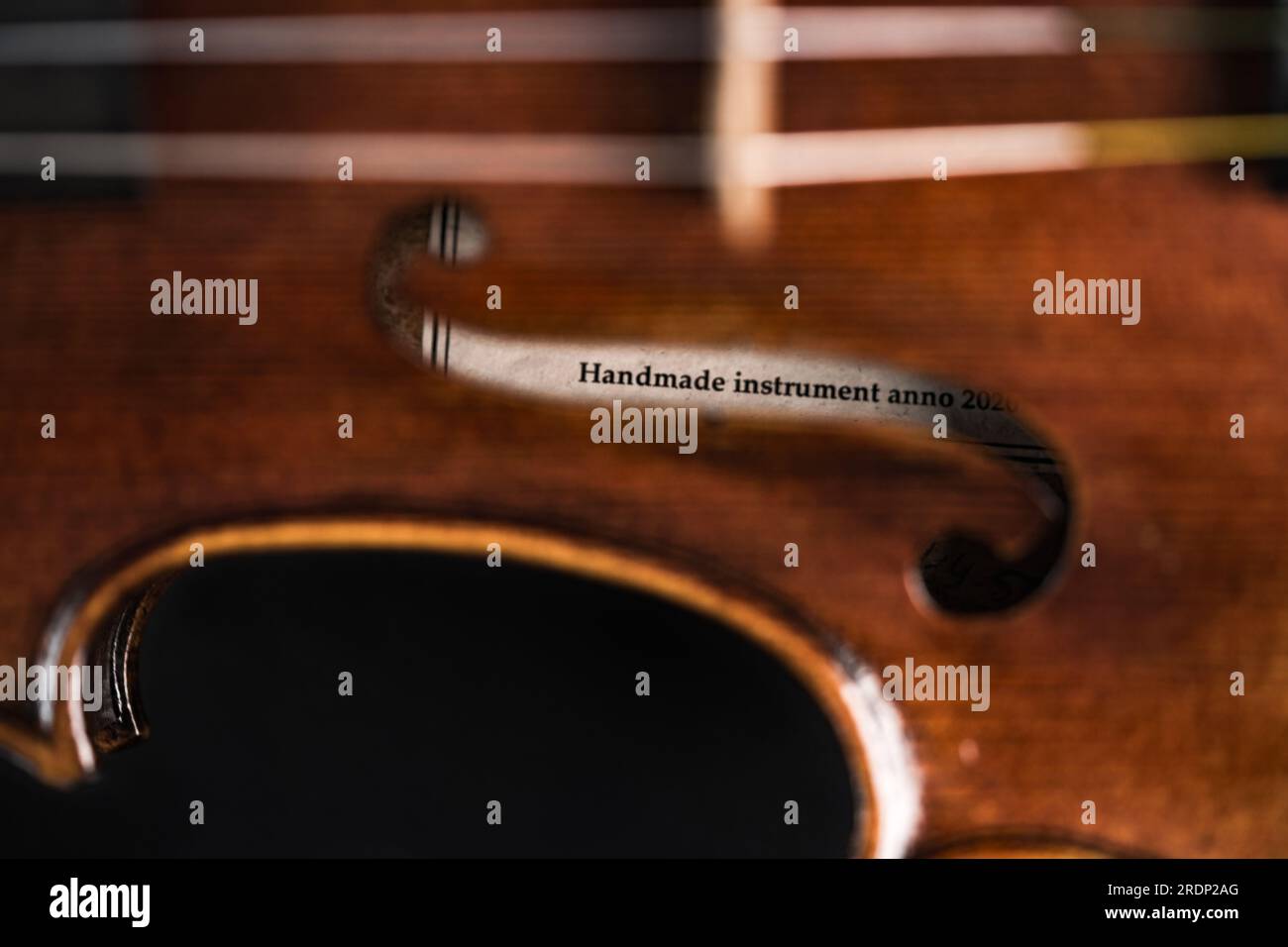 Label inside a violin with the inscription handmade instrument Stock