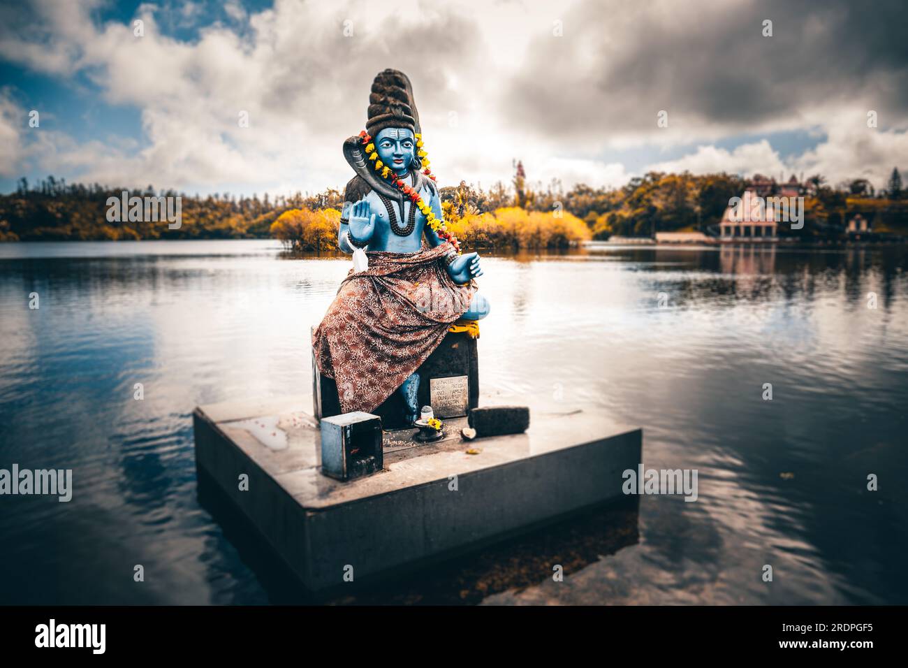 Asian Hindu statue in Mauritius and Bali. Gods temple and water. Worship operas and religion Stock Photo