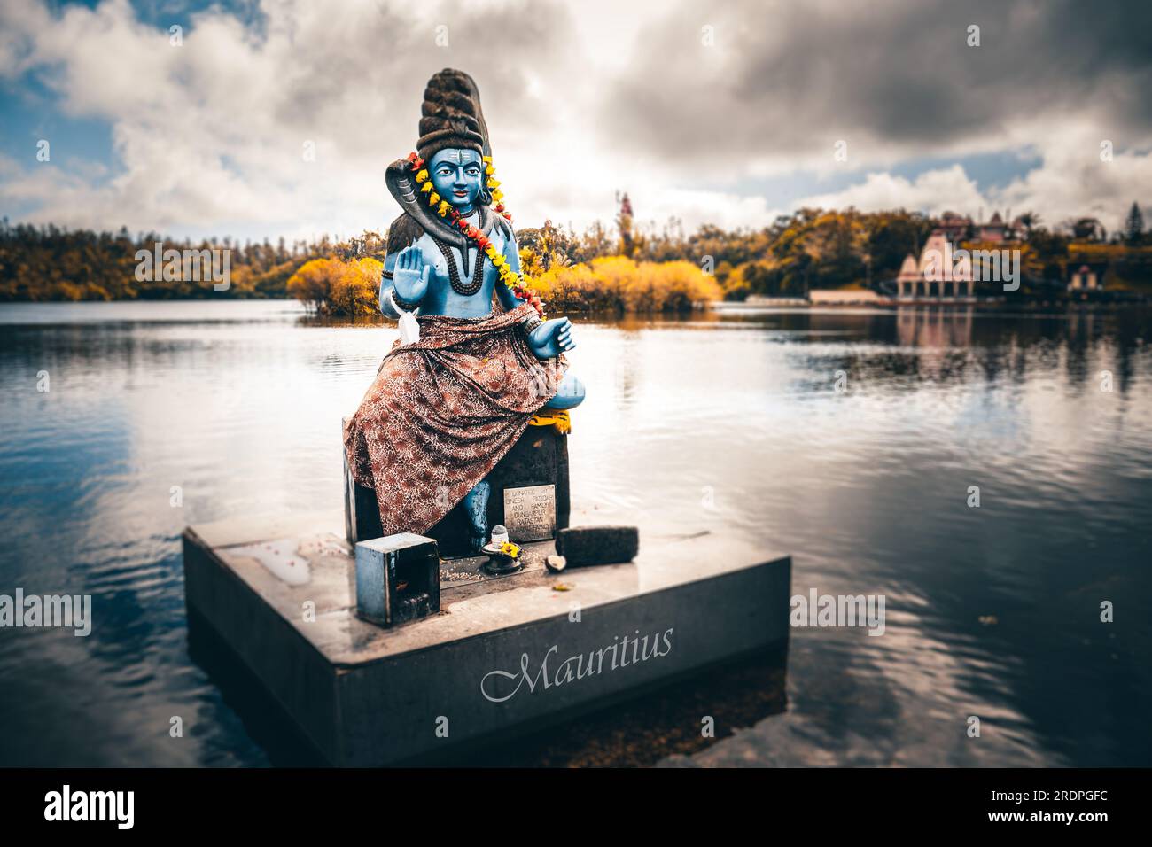 Asian Hindu statue in Mauritius and Bali. Gods temple and water. Worship operas and religion Stock Photo