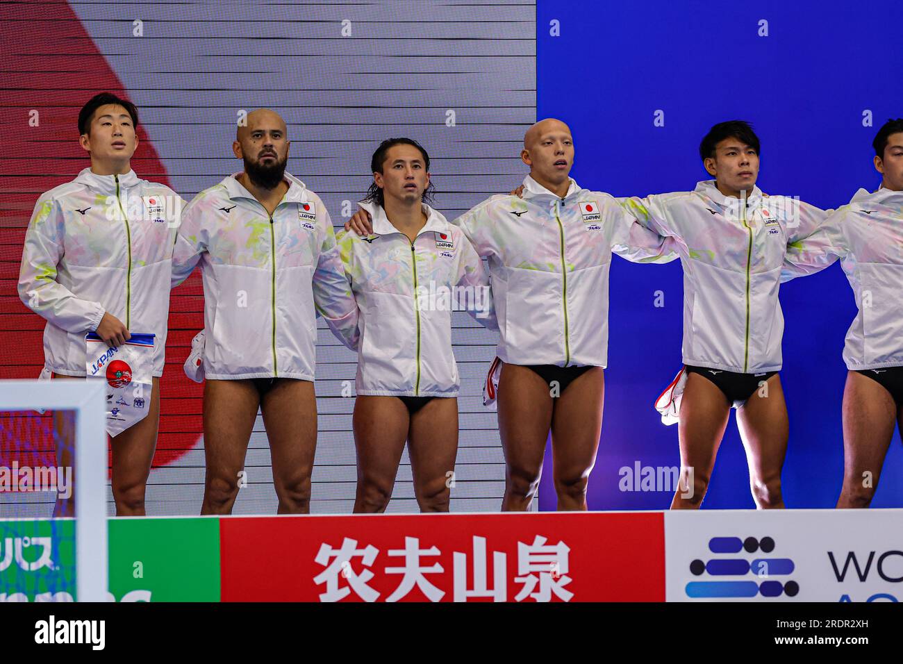 Fukuoka, Japan. 23rd July, 2023. FUKUOKA, JAPAN - JULY 23: players of Japan during the national anthem during the World Aquatics Championships 2023 Men's crossover match between Japan and Serbia on July 23, 2023 in Fukuoka, Japan (Photo by Albert ten Hove/Orange Pictures) Credit: Orange Pics BV/Alamy Live News Stock Photo