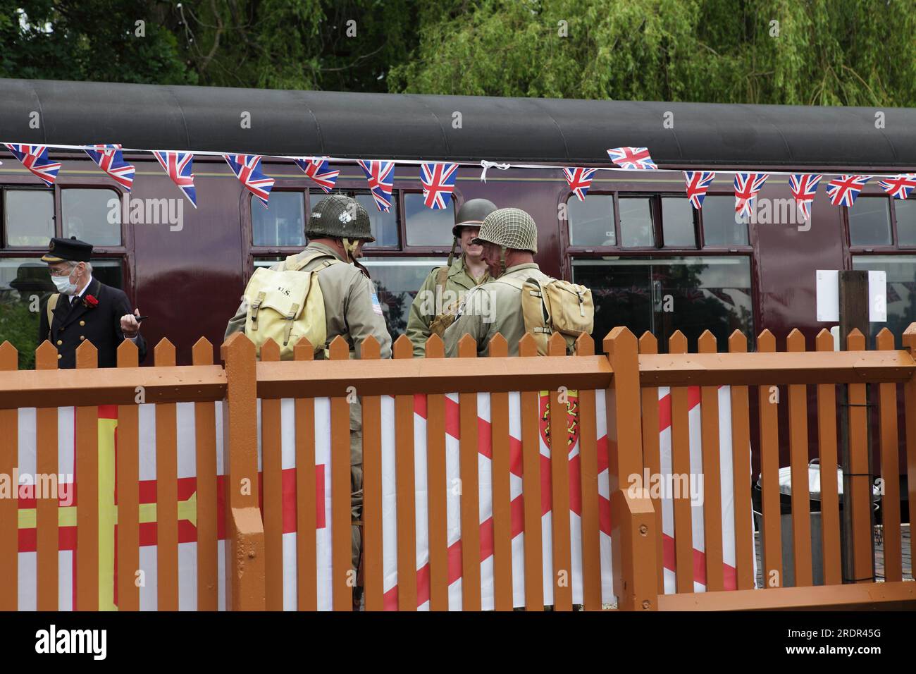 Enthusiasts dressed as American GIs have a chat during the stop at Arley Station during th Severn Valley Railway 1940s day. Stock Photo