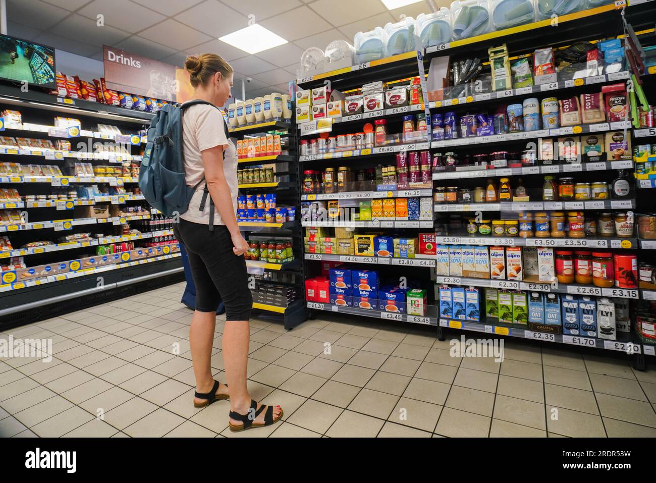 London UK. 23 July 2023 . A shopper at a local supermarket in Wimbledon