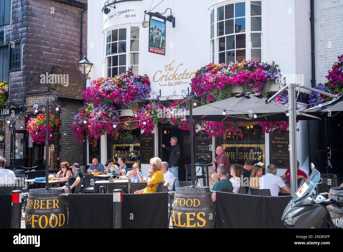 Brighton Views , Sussex , England , UK - The famous Cricketers pub in The Lanes area of Brighton with colourful hanging baskets Stock Photo