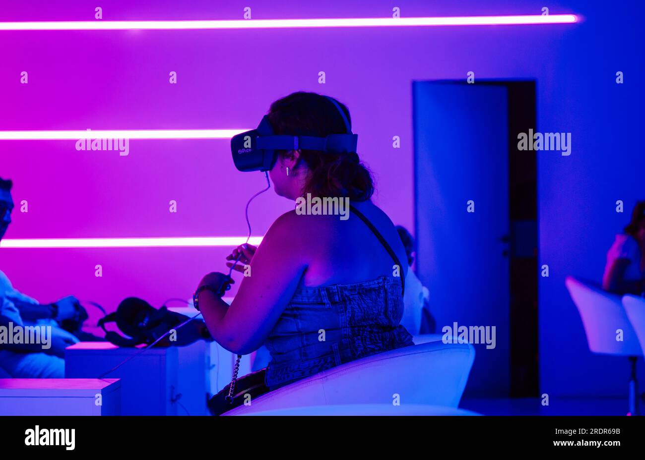 Madrid, Spain July 6 2023 Group of people with vr glasses in a virtual