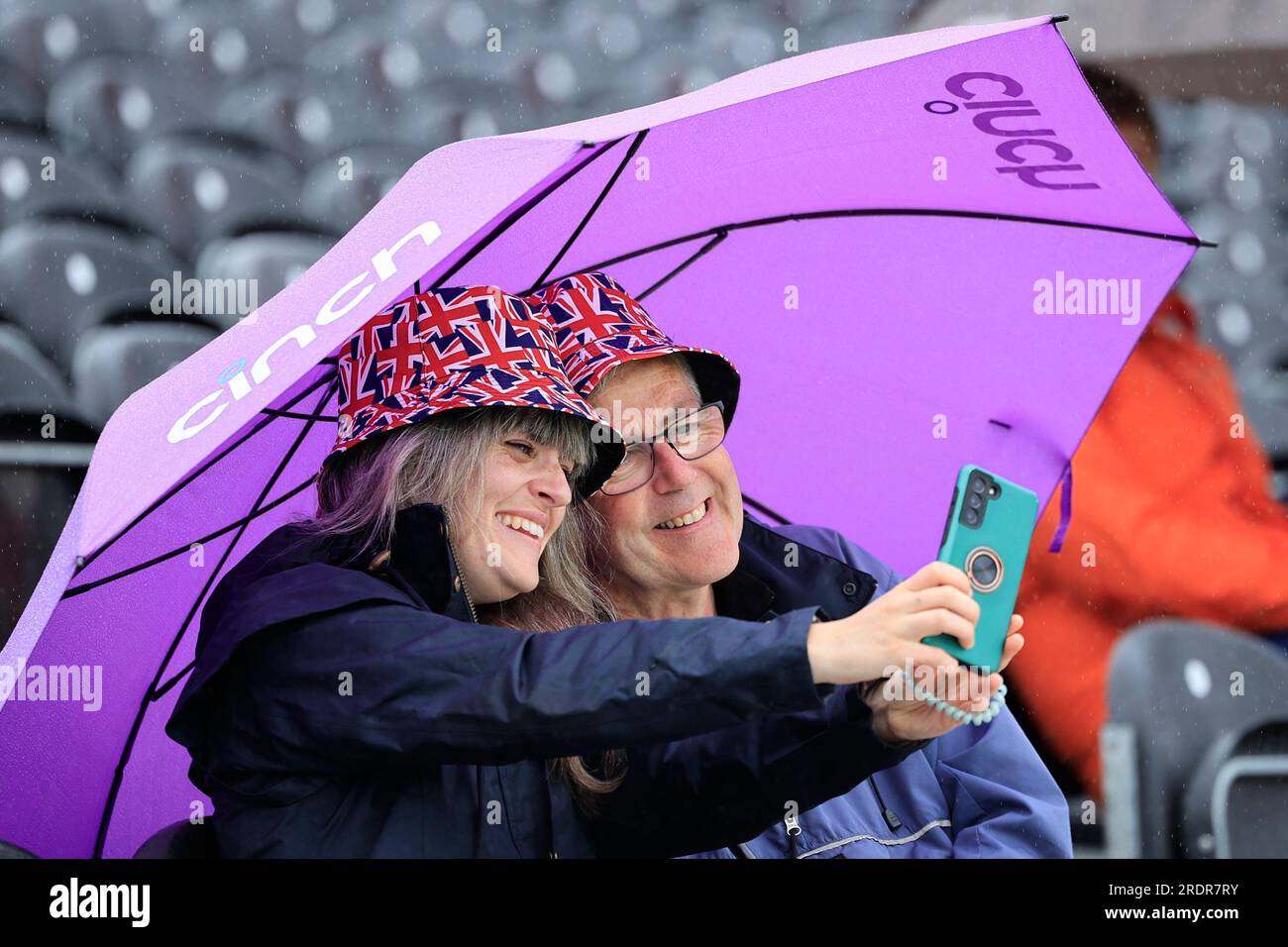 Cricket fans sheltering from the drizzle ahead of the LV= Insurance