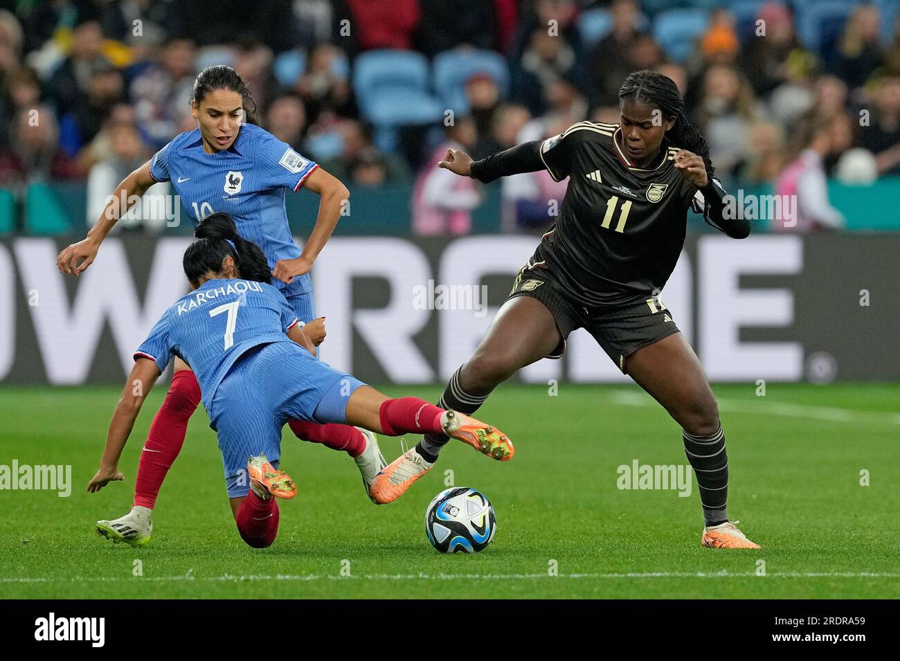 Jamaica's Khadija Shaw, right, challenges France's Amel Majri and