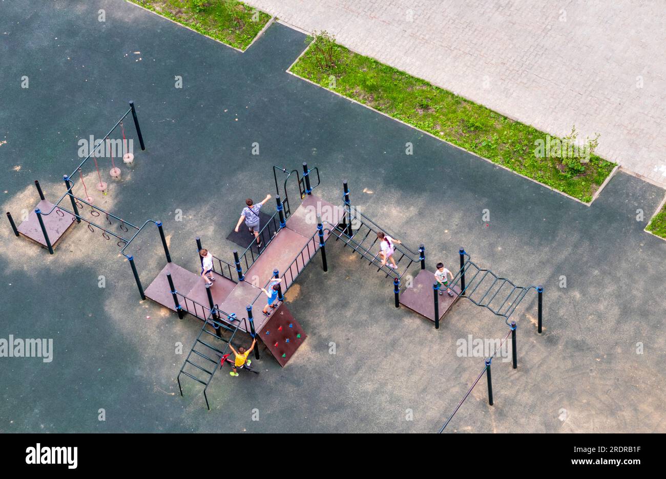 Kids playing on the playground hi-res stock photography and images - Alamy