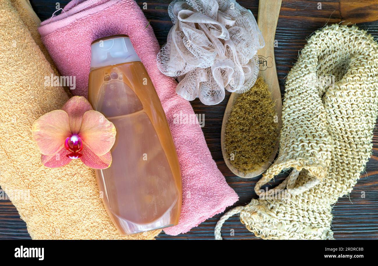 Shower gel bottle on the table among bathing accessories Stock Photo