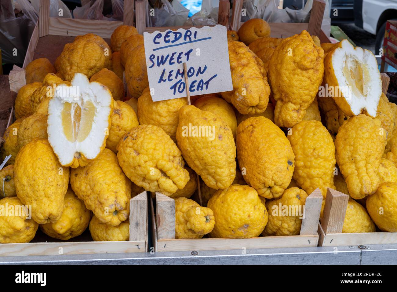 Fresh Cedri lemons sold at a local market in Sicily, Italy (translation cedri: large citrus fruit), horizontal Stock Photo