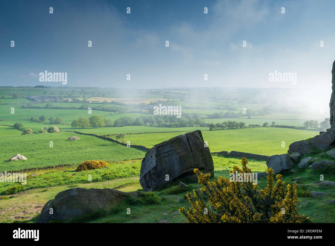 Mist around Almscliffe Crag and the Lower Wharfe Valley in late May. Stock Photo