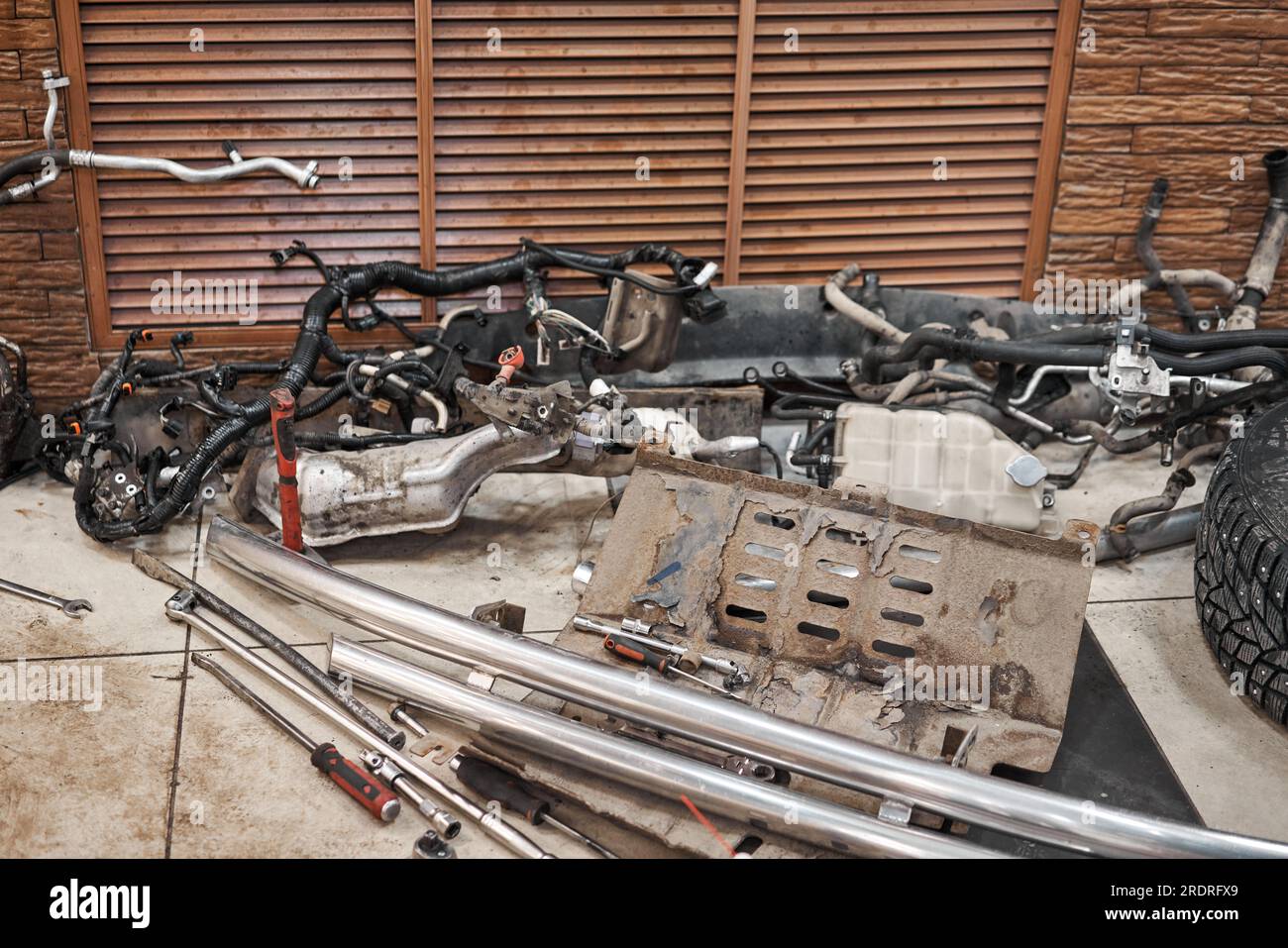 Lot of old car spare parts in service garage. Repair and recovery of