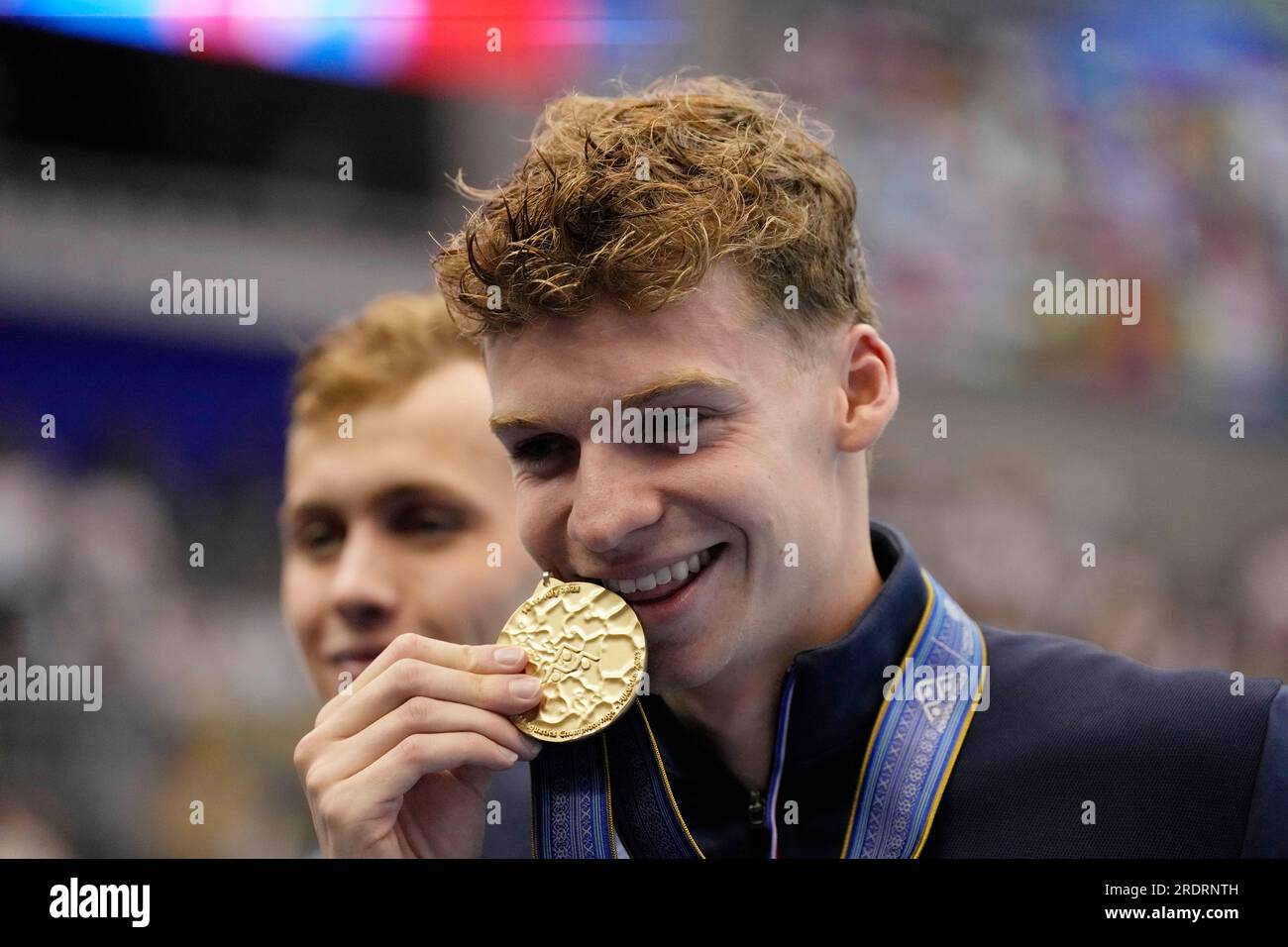 Gold Medallist Leon Marchand Of France Celebrates During Medal Ceremony ...