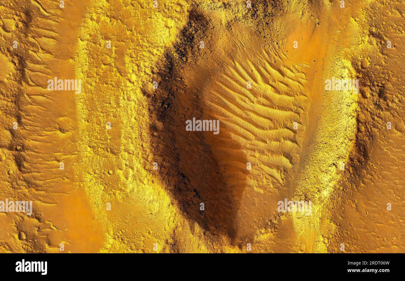 Planet Mars Exploration. Impact Craters in Hebrus Valles. Orange color land feature. Digital enhancement of an image by NASA Stock Photo
