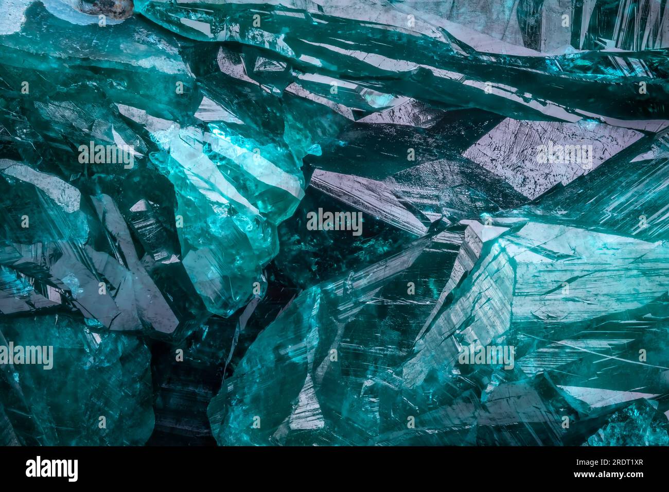 Dioptase crystal. macro detail texture background. close-up raw rough unpolished semi-precious gemstone Stock Photo