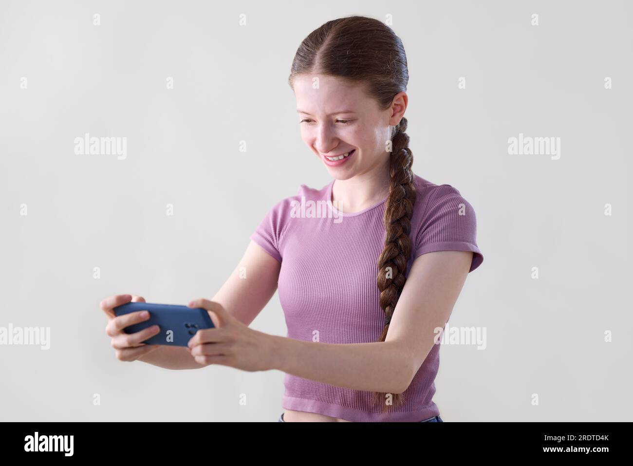 Young Boy and Girl Play Games and Listen To Music on Mobile Phones Stock  Photo - Image of hand, gamer: 135473906