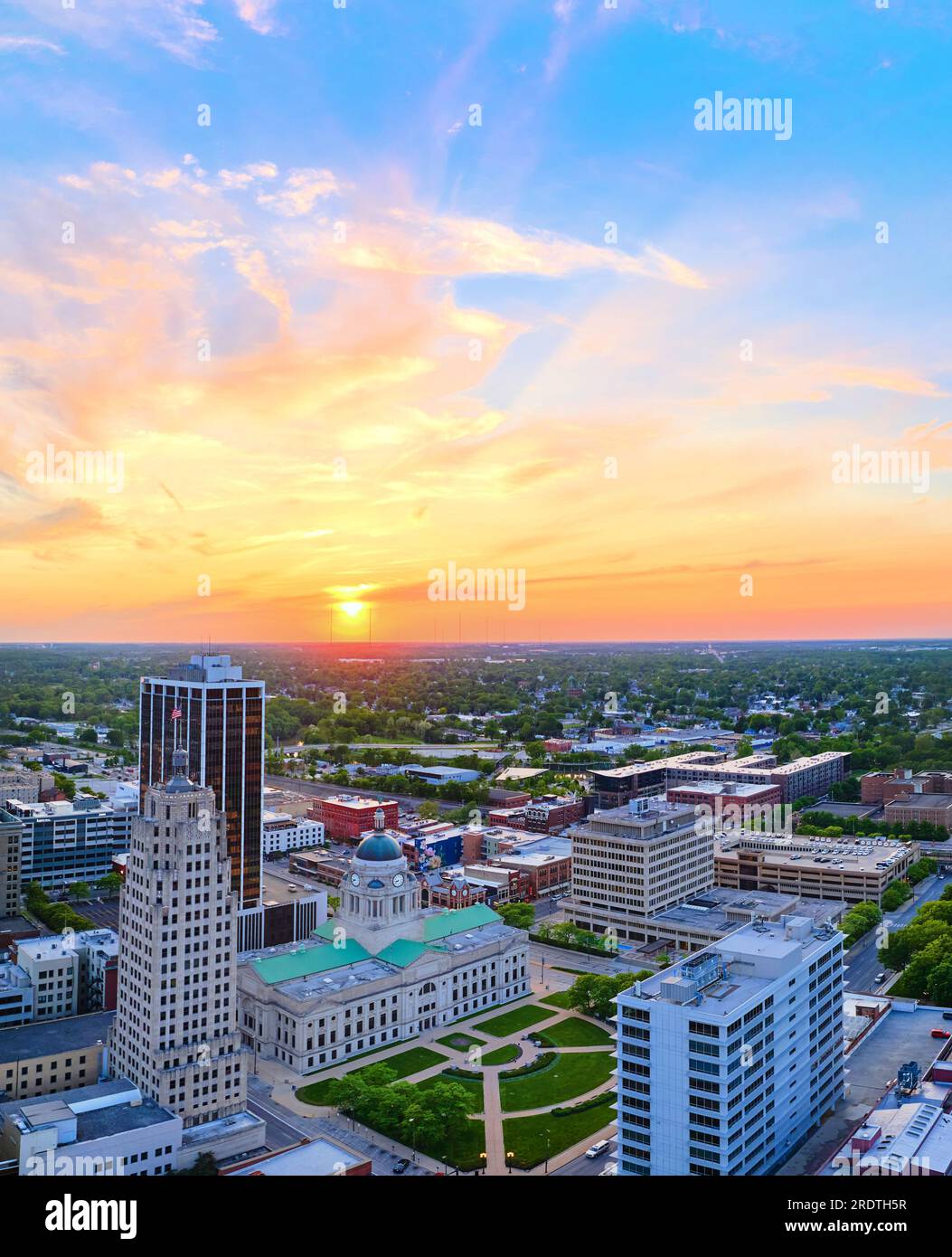 Vertical aerial panorama golden sunrise over downtown Fort Wayne with