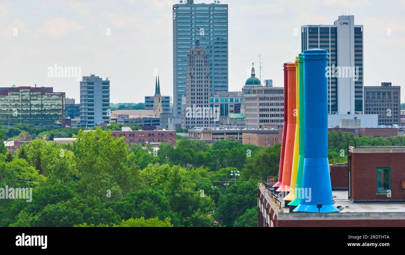 Rainbow painted Science Central smokestacks on left with distant