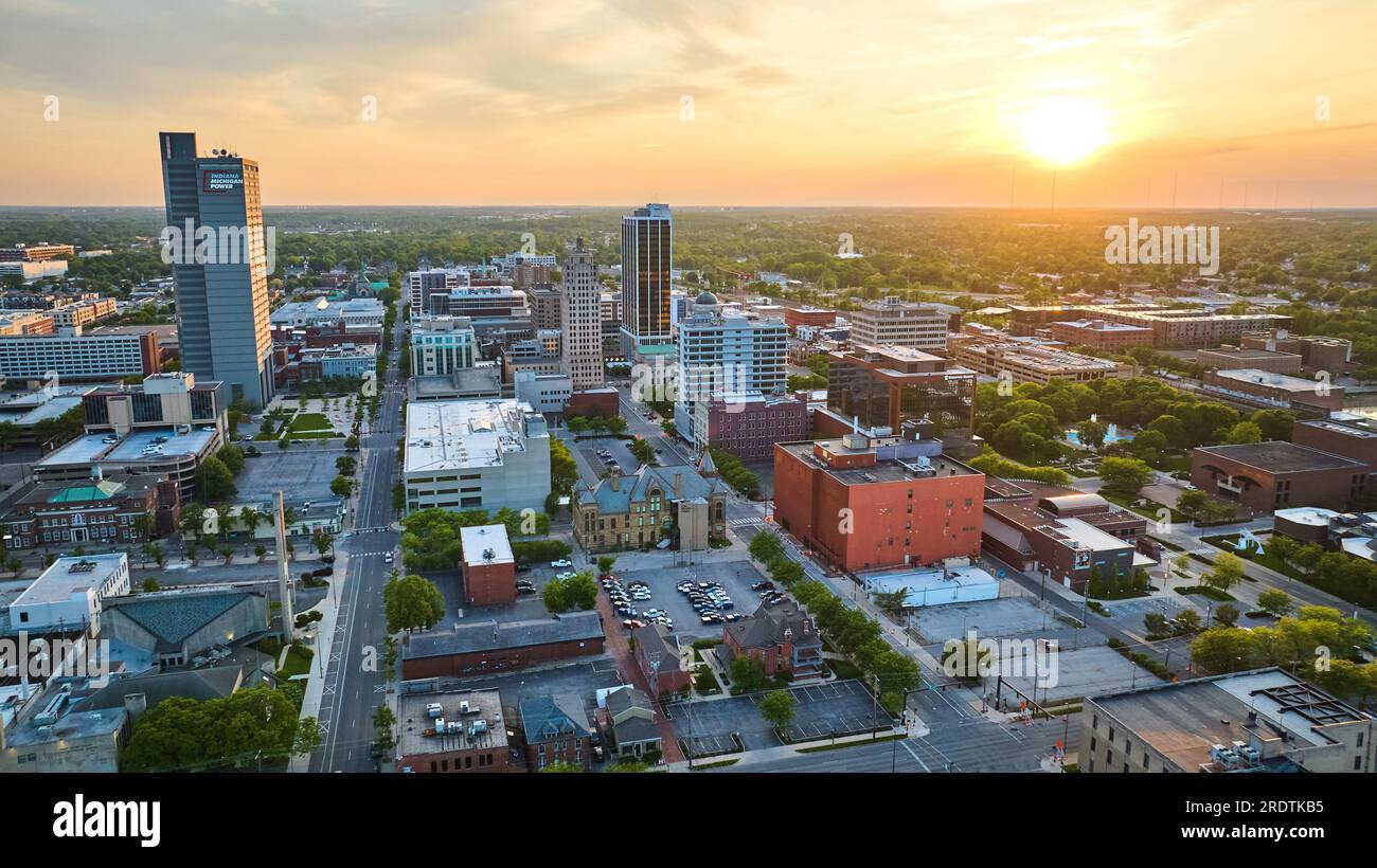 Sunrise over downtown Fort Wayne industrial buildings aerial Stock