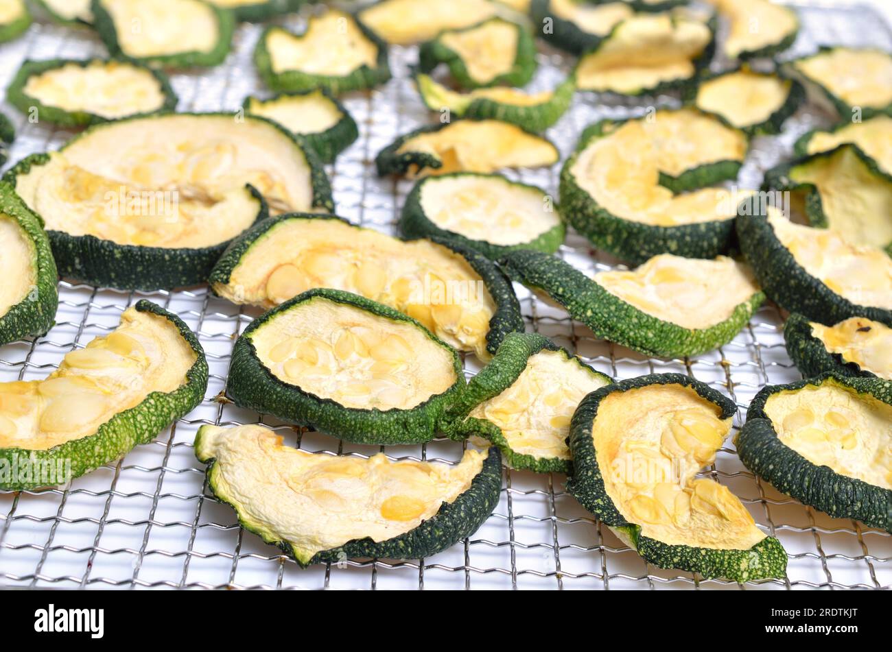 Dried zucchini slices isolated on white background. Stock Photo