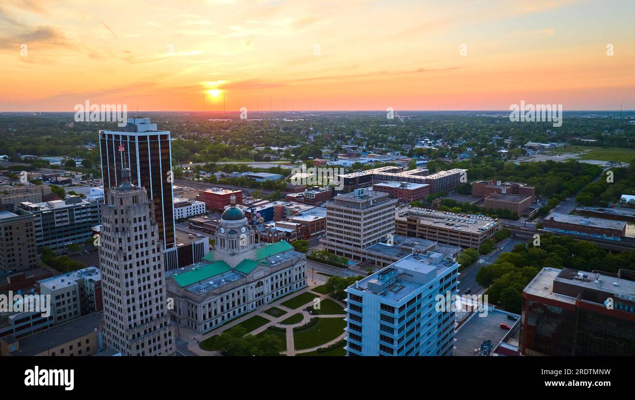 Horizontal aerial panorama golden sunrise over downtown Fort Wayne with