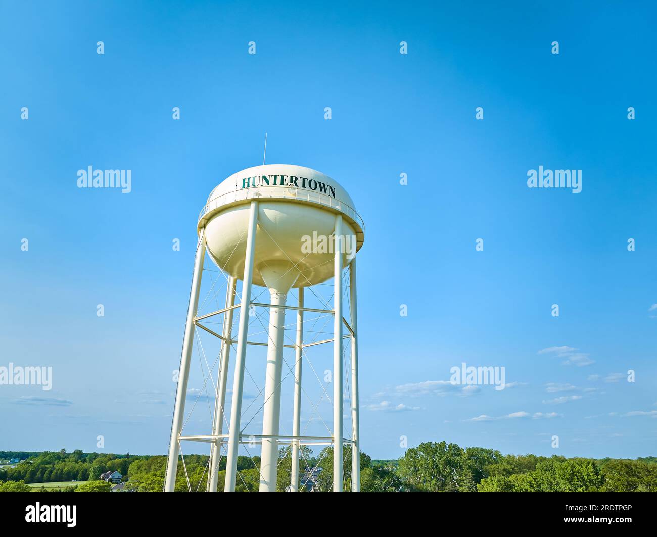 Aerial Huntertown water tower with underside visible and lots of blue