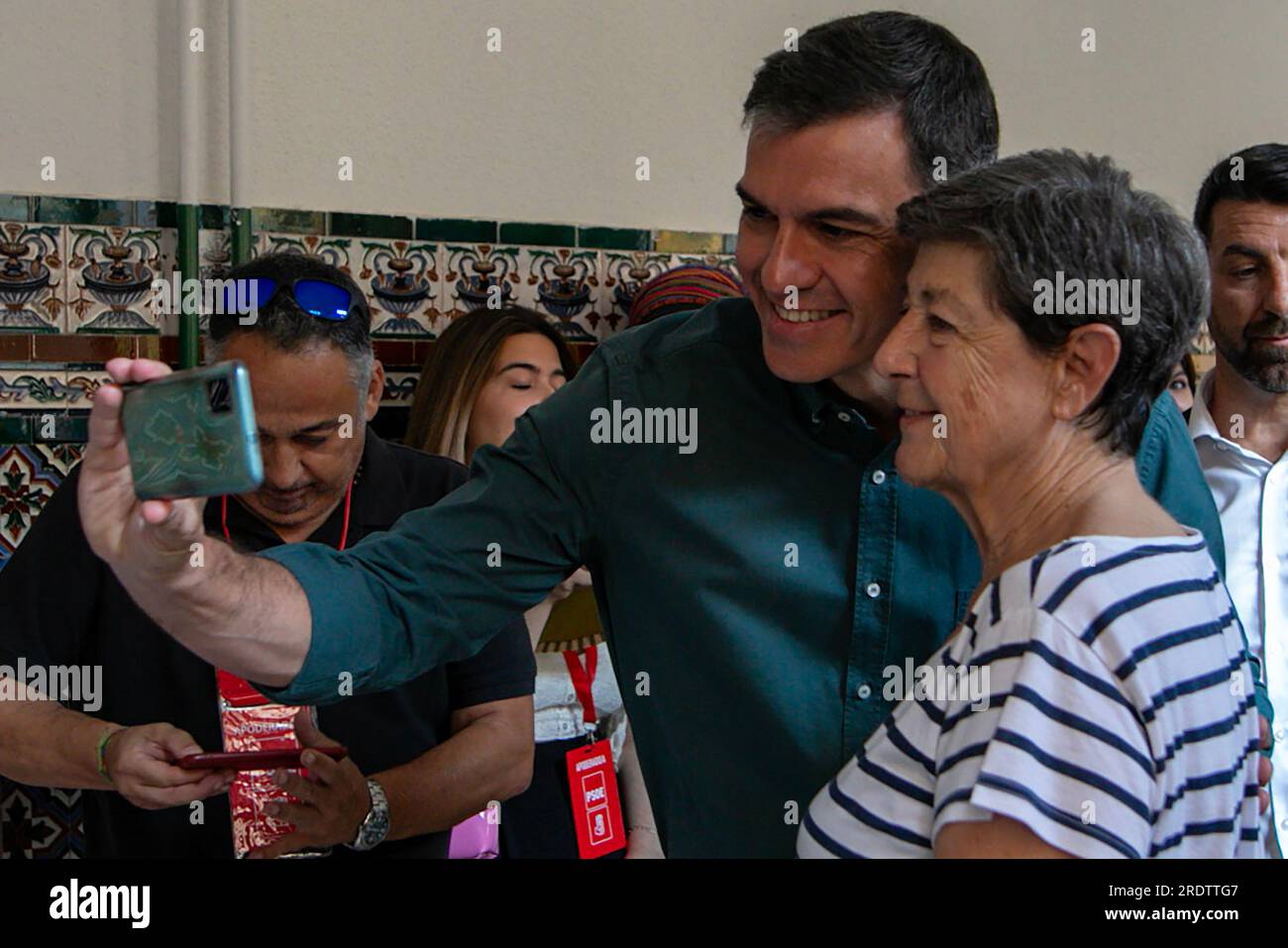 Madrid, Spain. 23rd July, 2023. Pedro Sanchez, President of the Government of Spain and candidate for the Spanish Socialist Workers Party (PSOE) takes a selfie with a supporter after exercising his right to vote at the Nuestra Señora del Buen Consejo school. (Photo by David Canales/SOPA Images/Sipa USA) Credit: Sipa USA/Alamy Live News Stock Photo