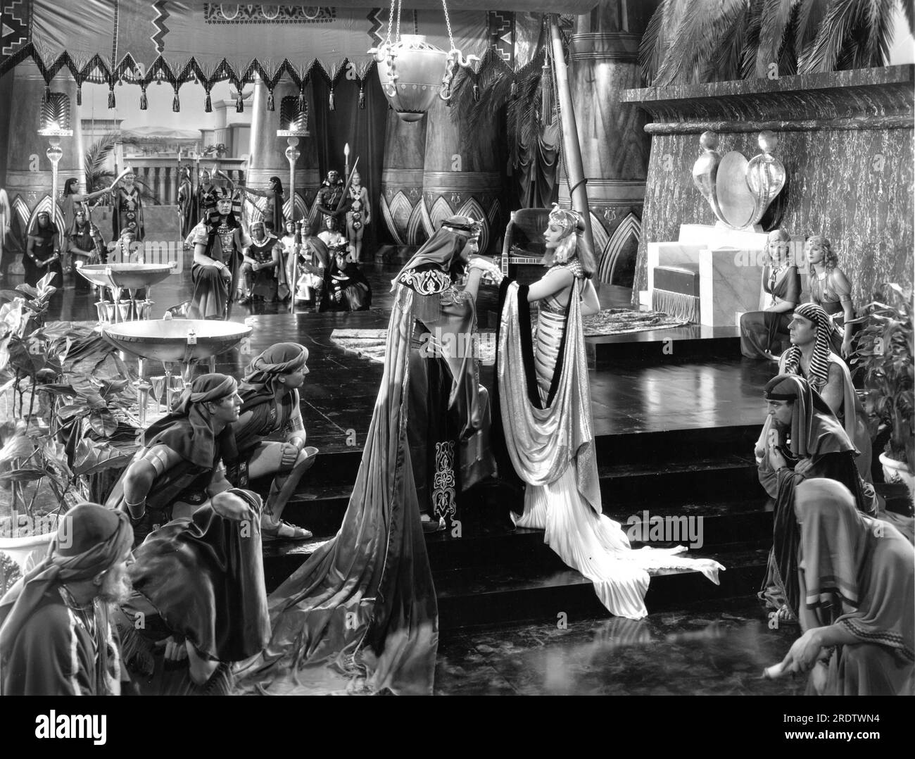 IRVING PICHEL JOSEPH SCHILDKRAUT CLAUDETTE COLBERT GRACE DURKIN and ELEANOR PHELPS in CLEOPATRA 1934 director CECIL B. DeMILLE Miss Colbert's costumes Travis Banton Paramount Pictures Stock Photo