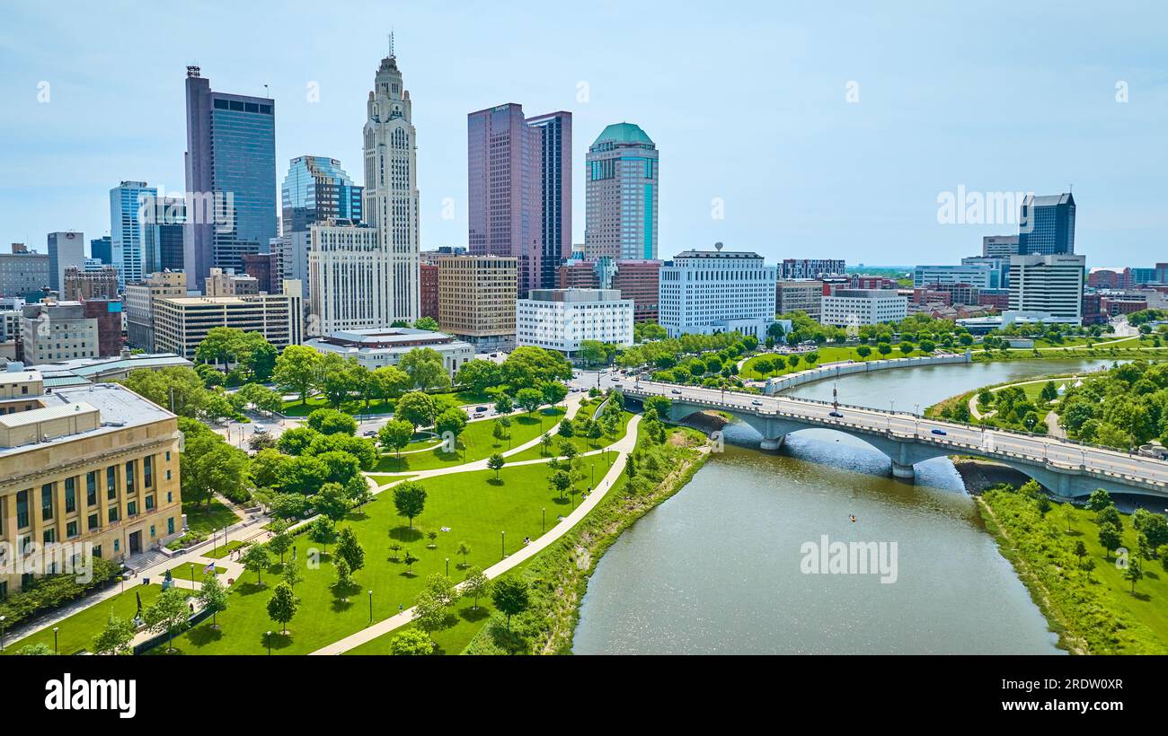 Summer day with green trees and trails aerial of Columbus Ohio downtown skyscrapers Stock Photo