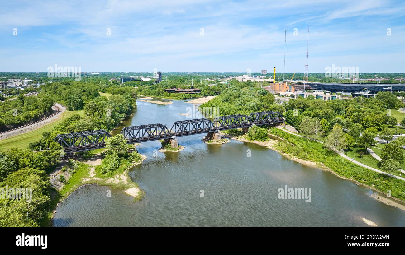Old train bridge over river outside Columbus Ohio aerial Stock Photo